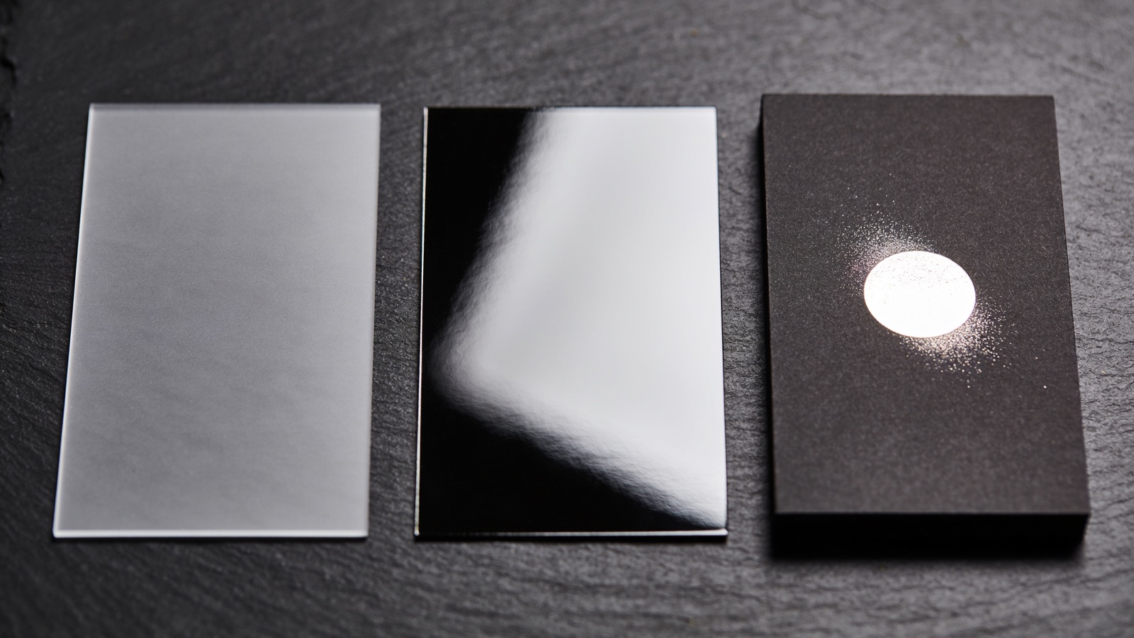 Matte, glossy and spot UV card finishes catching light differently